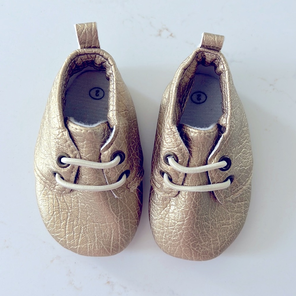 BNWOT Sweet n Swag Gold Baby Moccassins, Size 2.